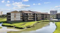 Outdoor Pool and Relaxing Balcony - Charming Coastal Sanctuary Hotels near NMB Nature Trail