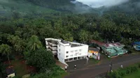 Sreeja Myst Hotels near Athirappilly Waterfalls Bottom View Point