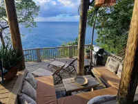 Spectacular clifftop house with hot tub next to sandy beach, stunning sea views