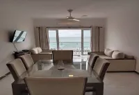 Enjoy a beautiful sunset from your ocean-view bedroom.