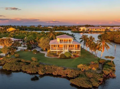 Large home on private penninsula with waterfront and views on three sides.