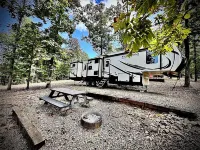 Cozy and serene RV in Broken Bow.  Pet friendly, WiFi, 2 bedroom, fireplace.