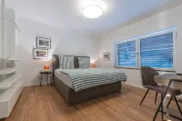 85qm Garten Suite mit 2 Schlafzimmern / Terrasse und Garten