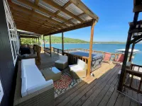 AMAZING WATERFRONT HOME WITH HOT TUB. BOTH HAVE EXTENSIVE VIEWS OF THE LAKE