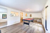 King bed with Pool table, decked patio and, gym.