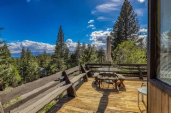 Charming Retreat with Lake Views and Spacious Deck - Inviting Escape
