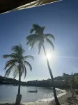 Water front, Minutes walk to beautiful Cowpet Bay Beach, pool, Bar& Restaurants.