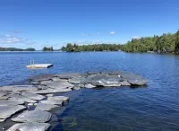 Beautiful lakefront camp with sunset view over big moose mountain