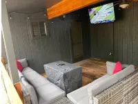 Caribou Cabin Outdoor Deck w Firepit Table & TV