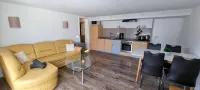 Charming apartment with sauna and large terrace, just a few steps from the beach.
