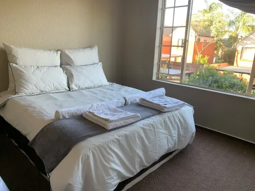 Entire 2 bedroom Duplex with wrap around garden in a secure complex