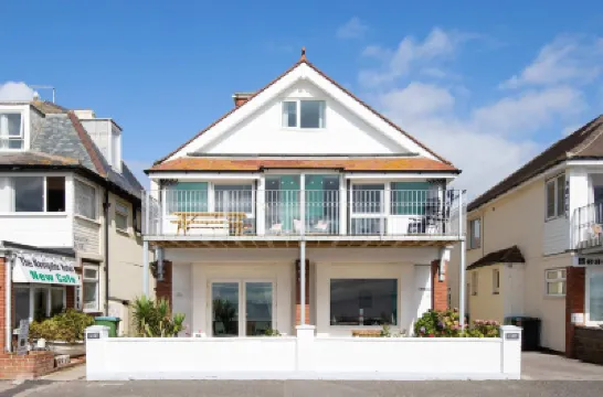 Absolute Beachfront with Decked Garden Oasis and Views Hotels in 