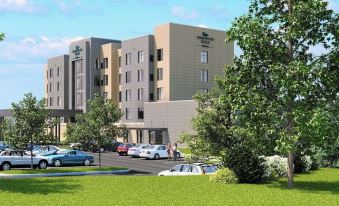 a rendering of the exterior of a hospital with cars parked in front and trees surrounding the area at Homewood Suites by Hilton Allentown Bethlehem Center Valley