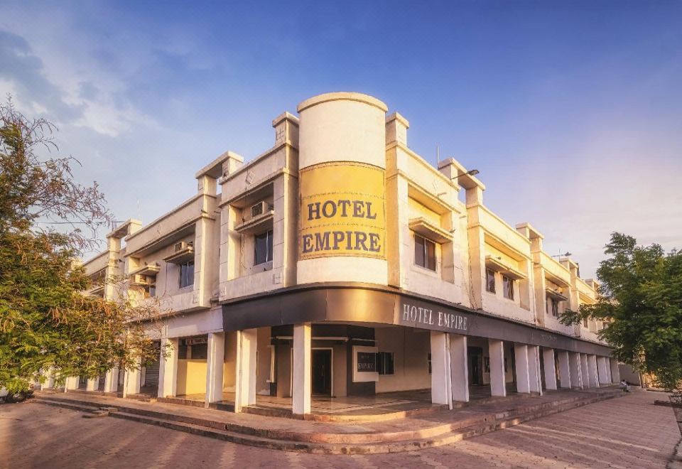 "a large hotel building with a sign that reads "" hotel empire "" prominently displayed on the front of the building" at Hotel Empire