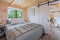 The Mighty Acorn, Bungalow is a delightful cozy tiny home in the woods.