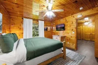 Prime location! Two king suites, hot tub and rock wall!