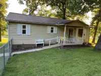 Relax at Grandma’s house with a screened in porch overlooking a private lake!