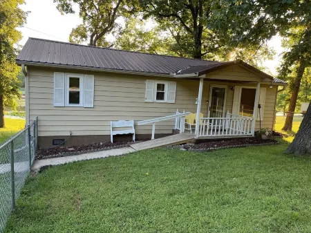 Relax at Grandma’s house with a screened in porch overlooking a private lake!