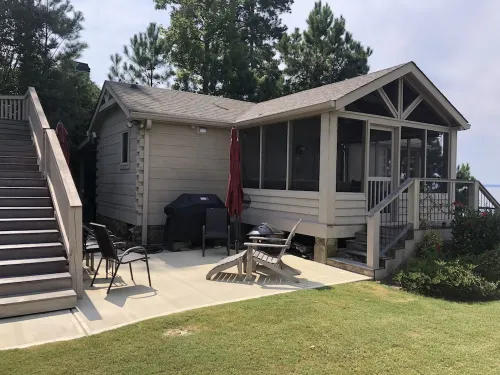 Cozy Lakefront Log cabin with miles of view plus small beach!