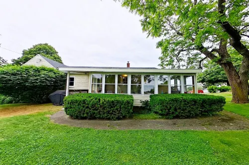 Johnson Homestead. One level living, ocean view with semi-private beach access.