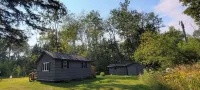 Charming cabin in delightful Duquette with AC near miles of ATV trails.