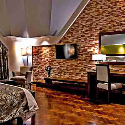 Magna Hotel and Suites Rooms