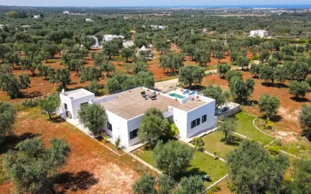 Spacious pool villa with sweeping sea views in extensive olive grove