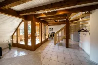 Beautiful penthouse duplex apartment with balcony surrounded by greenery