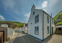 Cosy fisherman's cottage on the Pennan seafront.