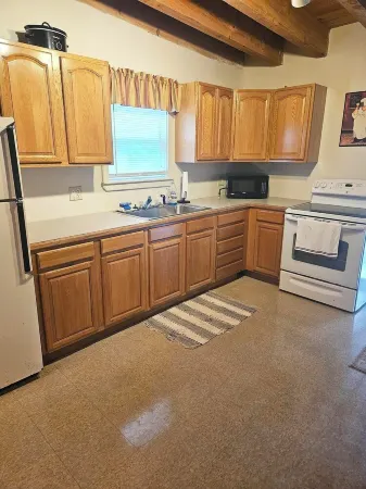 Charming 3-bedroom cabin in Casco with Sebago Lake access and a dock.