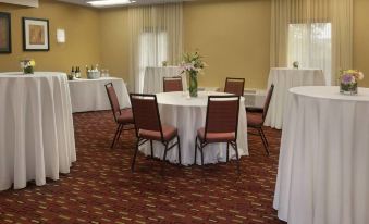 a well - organized conference room with white tables and chairs , ready for a meeting or event at Courtyard Philadelphia Valley Forge/King of Prussia