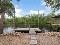 3-bedroom Riverfront home with private boat dock and view of Steinhatchee River.