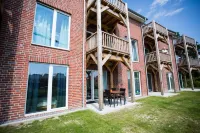 Modern, bright apartment with terrace, directly behind the dike, in the North Sea resort Wremen