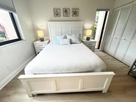 Coastal condo with patio, steps away from the beach in exclusive gated community