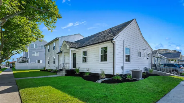 Stainless Steel Appliances and Flat-Screen TV - Modern Coastal Retreat
