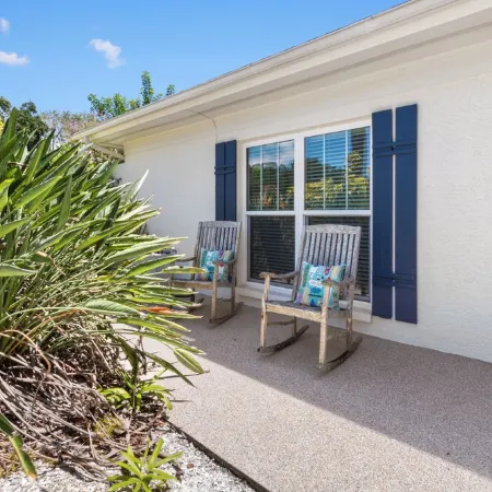This beauty is centrally located,  with a heated pool and water fall!