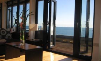 Beachfront Penthouse Apartment with Wrap-Around Balconies and Panoramic Sea Views
