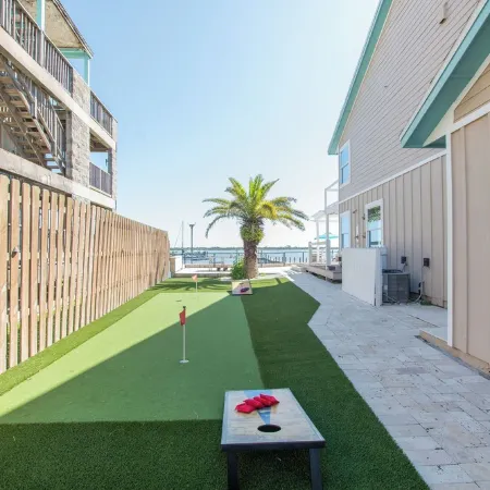 Waterfront home with dock, heated pool, & spectacular views- walk/bike downtown!