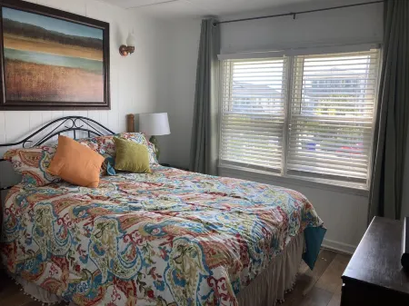 Just steps to the beach, bar, and playground park!