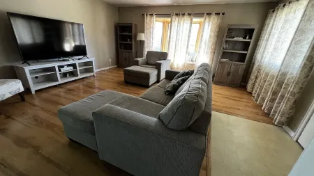 Quiet neighborhood, relaxing wrap around deck with fire pit. Short walk to town.