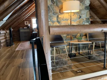 Modern Log Cabin in woods with two gas fireplaces; 20 acres; great location.