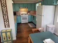 Open concept 2 bedroom ranch with attached garage and deck
