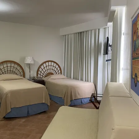 Aparta Hotel Plaza del Sol Отели рядом с достопримечательностью «Автозаправочный комплекс Expreso Bavaro»
