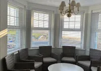 Pendragon House Overlooks Crooklets Beach in Bude with parking for 5 cars.