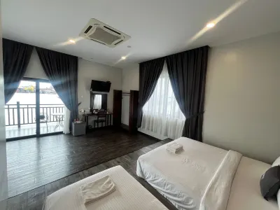 Capital O 91170 Kurau Bay Hotel Hotels near Xiao Yi Ci Memorial Park Berhad