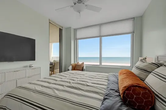 Beachfront! Coastal Designer Glam with Resort Amenities. Private Balcony & Grill