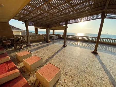 The red villa is the first north coast road, 15 minutes from the airport.