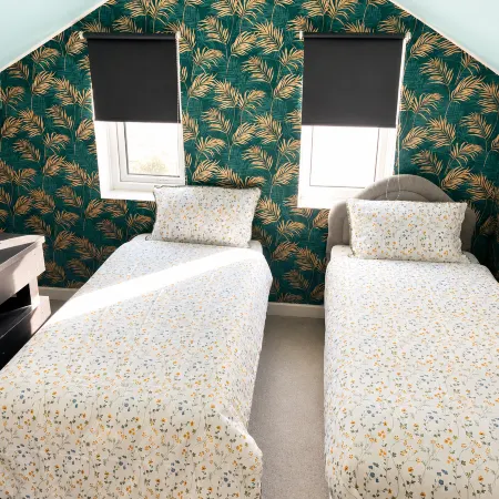 Twin single bedroom perfect for contractors and football fans