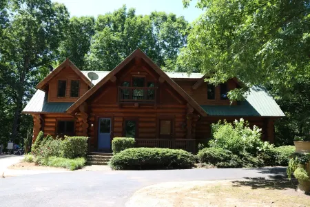 Rustic cabin sitting on acres of pastures nestled in the mountains of North GA