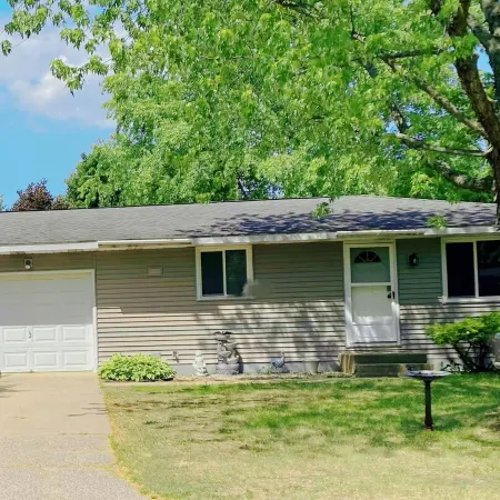 Fantastic Oasis Home in Stevens Point with fully enclosed fence for backyard!